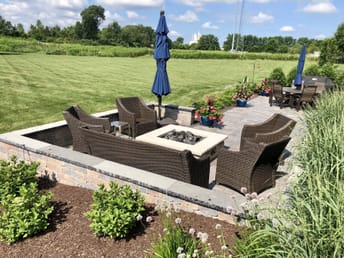 fireplace and chairs outdoor patio