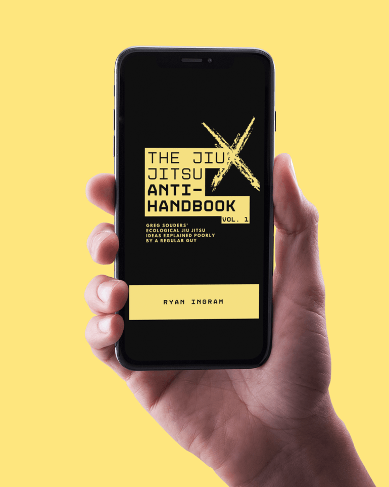 Jiu Jitsu Anti-Handbook Image of Cover on Phone in Hand.png