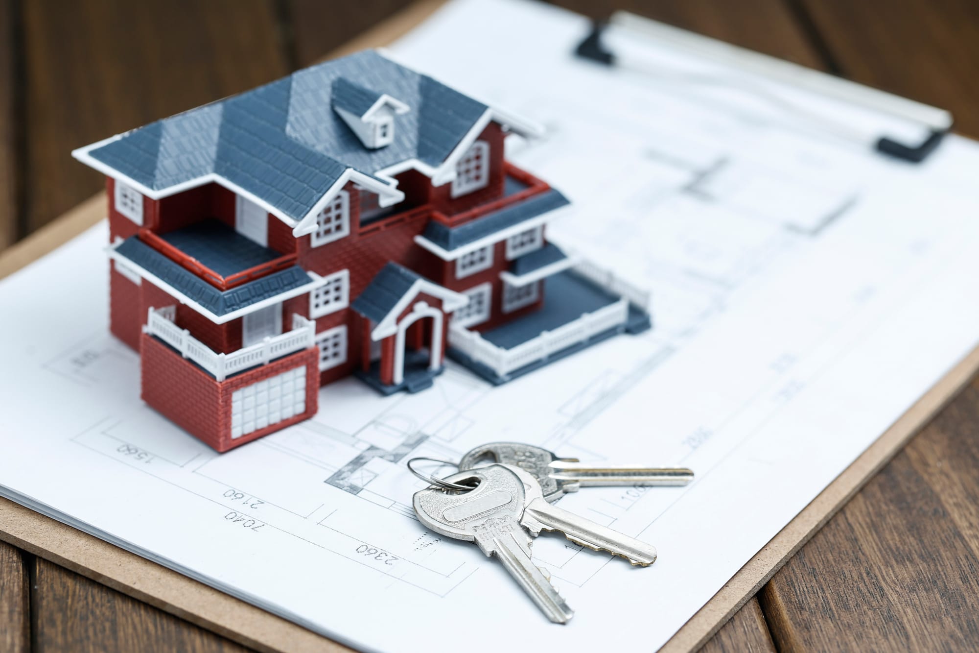 villa-house-model-key-drawing-retro-desktop-real-estate-sale-concept.jpg