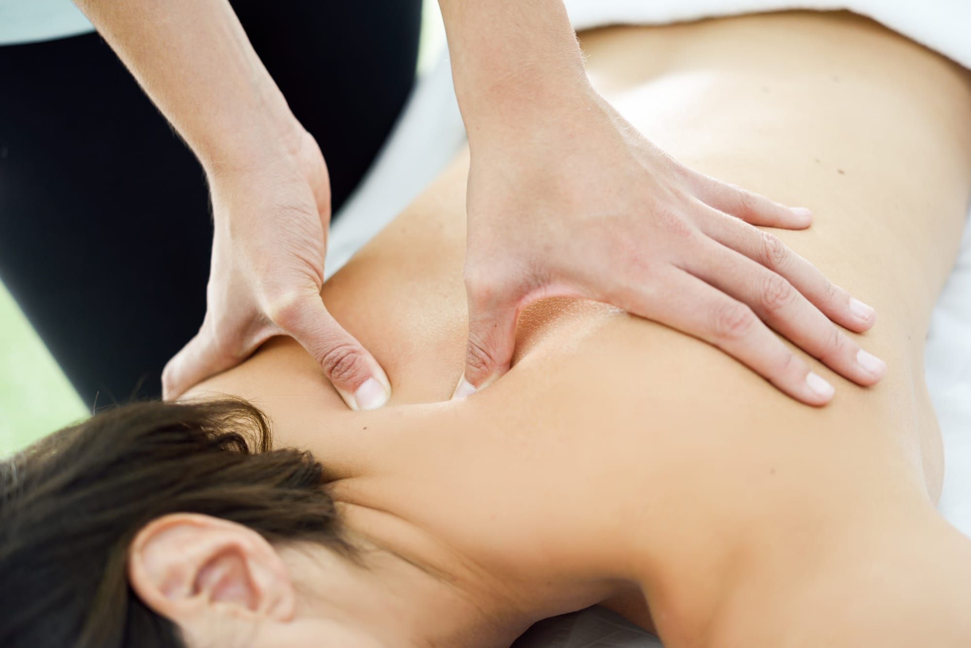 young-woman-receiving-back-massage-spa-center.jpg